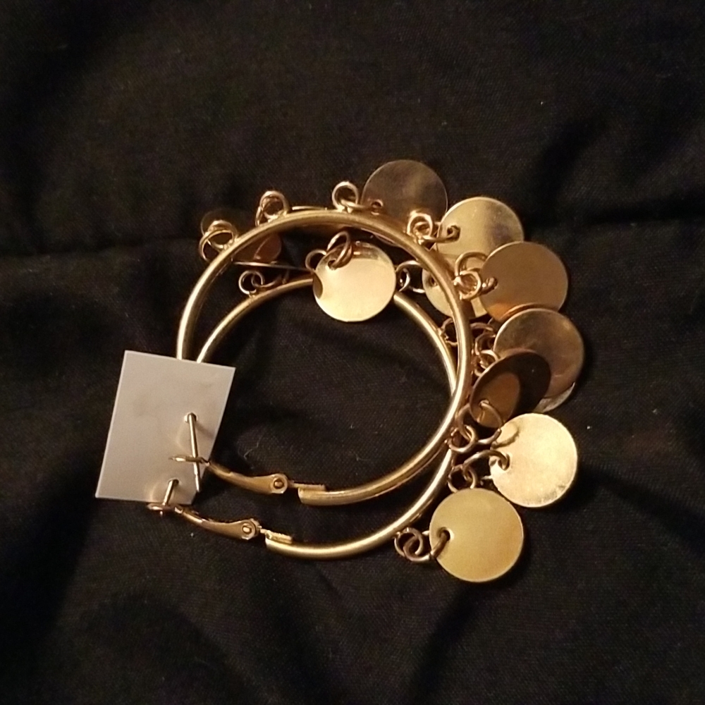 Gold hoop earrings with round tassles